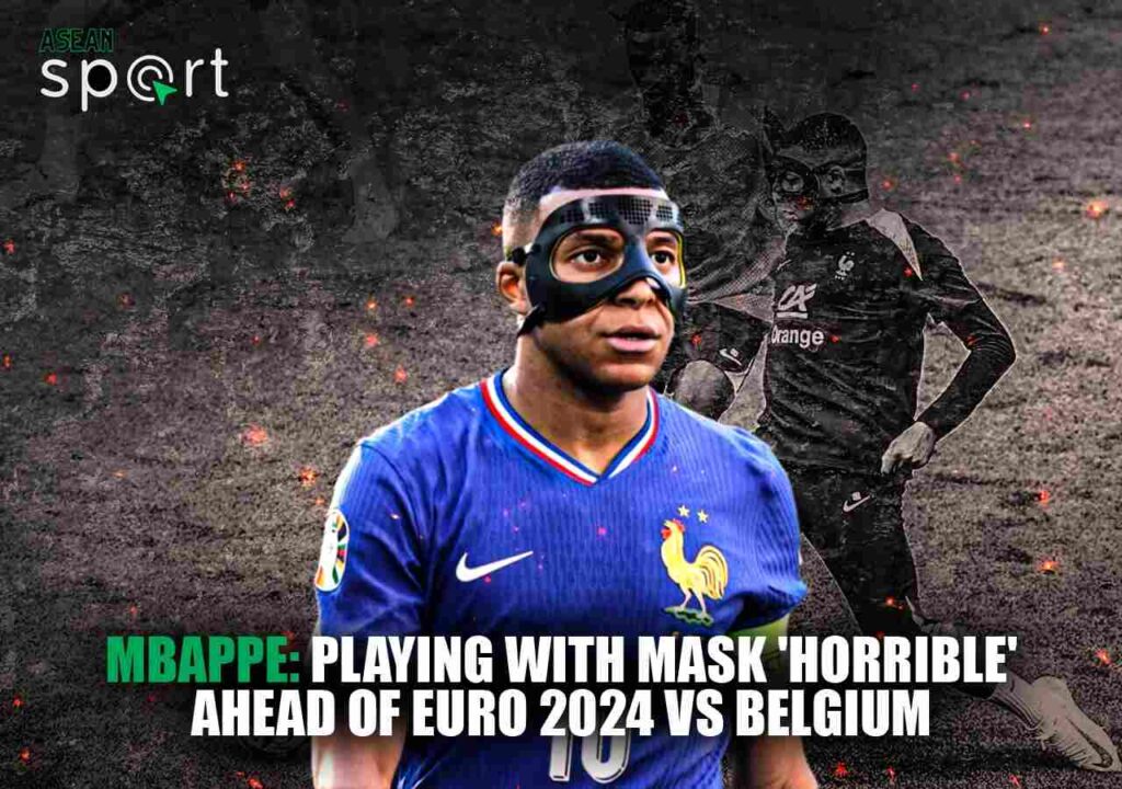 Kylian Mbappe wearing a protective mask on the field, expressing discomfort ahead of France's Euro 2024 match against Belgium. The image highlights his struggle as the France captain with a broken nose.